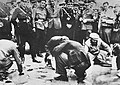 Nazis force Vienna's Jews to wash the ground after Hitler (1938) invaded Austria