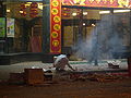 A Shanghainese man setting off firecrackers (2008)