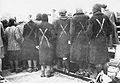 Surviving female prisoners meet with the Red Cross in April 1945. The white paint crosses showed they were prisoners