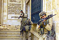 U.S. soldiers (2003) enter one of Saddam Hussein's palaces during the War in Iraq