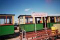 Steam tram at tramstop Valkenburgse Meer, with railway museum at the background