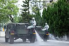 Taiwanese 33rd Chemical Corps spraying disinfectant on a street in Taipei, Taiwan