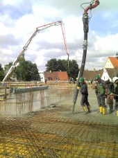 Placement of ready-mixed concrete by means of a concrete pump