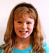 A blonde that is only minimally reddish is called strawberry blonde.