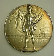 Medal from the 1920 Olympics references the nudity of athletes in the Ancient Olympics