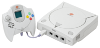 An NTSC Sega Dreamcast Console and controller with VMU.