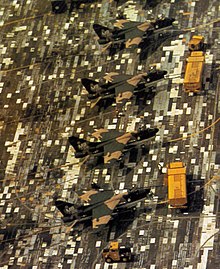 Camouflage aircraft by adjusting the background