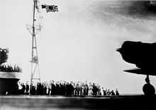 The crew of the Shōkaku bids farewell to an aircraft taking off with banzai calls