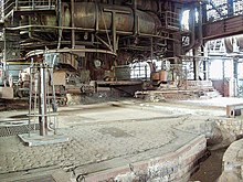 Tapping hall at blast furnace 5 in the Duisburg-Nord landscape park with tapping hole, drilling machine, tamping machine and part of the channel system