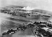 Battleship Row at the beginning of the attack. Oklahoma and West Virginia are already showing list, the West Virginia is just receiving a torpedo hit.