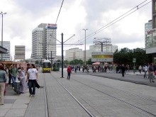 Tram on the Alexanderplatz. In the background the Urania world time clock and the House of Travel, 2005.