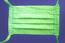 Hand-sewn everyday mask made of two layers of cotton fabric with retaining straps