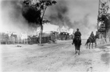 Two mounted German soldiers in a burning village near Mahiljou (Belarus), 16 July 1941