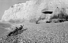 German soldiers in deck chair in front of fortifications in Normandy (1942)