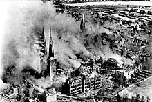 The burning Lübeck Cathedral after the attack at the end of March 1942