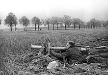 Volkssturmmann with rocket-propelled grenade ("Panzerschreck") in front of Berlin (April 1945)