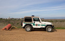 Smoothing the ground at the U.S.-Mexico border to make footprints visible