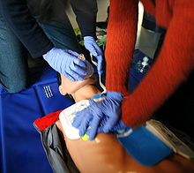 Correct posture for chest compressions. Elbows extended, shoulders vertically above hands.