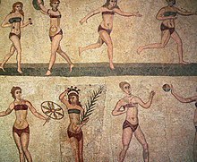 Girl playing sport in bikini, Villa del Casale, Sicily