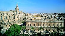 The archive of the Casa de Contratación in Seville, with the cathedral on the left.