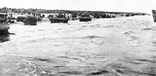 Floating tanks roll onto the beach