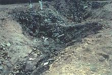 10:03: UA93 crashes near Shanksville. Shot of the impact crater