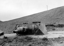Stationary use of a Panzer IV gun turret (7.5 cm caliber) in a German position near Omaha Beach.