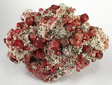 compared to a garnet mineral specimen