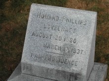 Lovecraft's tombstone, inscribed "I AM PROVIDENCE."