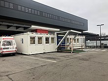 The adapted entrance to the emergency outpatient department of St. Pölten University Hospital with a COVID-19 pre-triage of patients (December 2020).