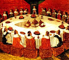 El Rey Arturo preside la Mesa Redonda.