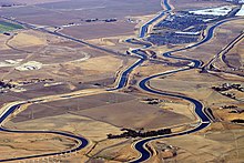 Section of the California Aqueduct with intersection of California Interstate 205.