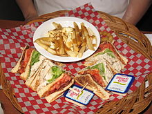 Poutine as a side dish for a club sandwich