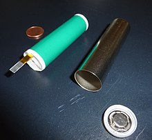Cylindrical accumulator cell (18650) before assembly. A few thousand of these will be integrated and interconnected into a larger system called the traction battery to perform the energy storage function for the Tesla Model S electric car.