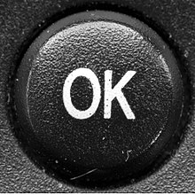 OK button of a remote control, for final confirmation of an input