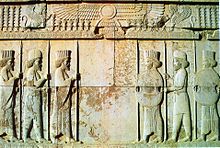 Apadana hall, above: the sign of Faravahar guarded by Lamassus