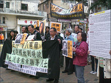 Demonstrators protest in Hong Kong against the arrest of Liu Xiaobo
