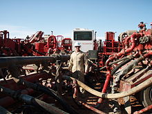 Mixing apparatus for mixing the frac fluids to the water, prior to injection into the well.