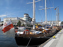 Ships at the Gdynia marina with a view of the planetarium