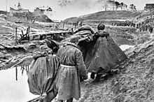 Soviet soldiers recovering a wounded man near Leningrad, October 1941