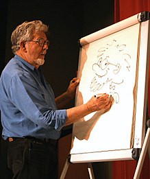 Rolf Harris dibujando un autorretrato de Rolfaroo