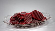 Slices of pickled beetroot with the crayon knife with decorative wavy surface.