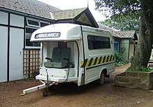 The ambulance pulled by a tractor