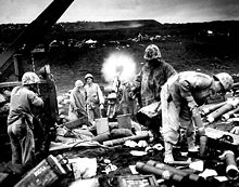 105-mm gun in the black sands of Iwojima