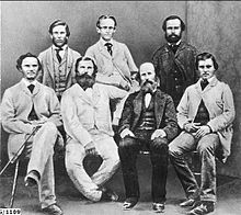 Group of men, some sitting, some standing