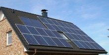 House roof with photovoltaic system for electricity and solar collector for hot water production