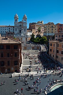 The Spanish Steps, in Italian Scalinata di Trinità dei Monti, with the church Santissima Trinità dei Monti in the background.