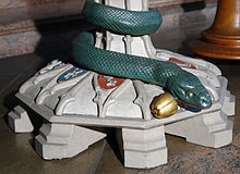 Sin, symbolized by the snake, is expelled through baptism. Baptismal font in St. John (Bremen)