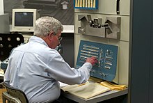 Steve Russel, member of the Tech Model Railroad Club of MIT, at a PDP-1 computer.