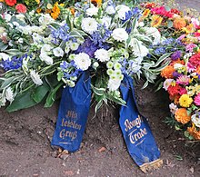 Mourning arrangement of the record label Rough Trade Records on the grave of Czukay